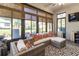 Bright and airy sunroom with comfortable seating and large windows at 15750 Sw 11Th Court Rd, Ocala, FL 34473