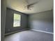 Spacious bedroom with gray walls and tile floors at 15805 Sw 37Th Cir, Ocala, FL 34473