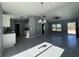 Open living room and kitchen with gray walls and tile floors at 15805 Sw 37Th Cir, Ocala, FL 34473