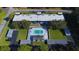 Aerial view of the building, pool, and parking area at 1640 Ne 40Th Ave # 107, Ocala, FL 34470