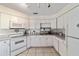 Bright eat-in kitchen with white cabinets and granite countertops at 3645 Ne 18Th Ct, Ocala, FL 34479