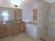 Main bath with granite vanity, soaking tub, and shower at 4085 Sw 49Th Ave, Ocala, FL 34474