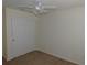 Well-lit bedroom featuring a ceiling fan and double-door closet at 4085 Sw 49Th Ave, Ocala, FL 34474