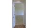 Open door revealing a large bedroom with tiled floors at 4085 Sw 49Th Ave, Ocala, FL 34474