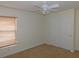Well-lit bedroom with ceiling fan and window coverings at 4085 Sw 49Th Ave, Ocala, FL 34474