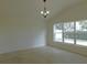 Bright dining room with large window and a chandelier at 4085 Sw 49Th Ave, Ocala, FL 34474