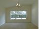 Bright dining room features a large window and tile floors at 4085 Sw 49Th Ave, Ocala, FL 34474
