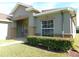 Front view of a single story house with manicured hedges at 4085 Sw 49Th Ave, Ocala, FL 34474