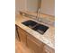 Double sink with granite countertop and modern faucet at 4085 Sw 49Th Ave, Ocala, FL 34474