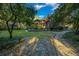 Landscaped backyard with stone pathway and lush greenery at 5004 Se 5Th Ave, Ocala, FL 34480