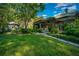 Spacious backyard features a large grassy area and mature trees at 5004 Se 5Th Ave, Ocala, FL 34480