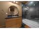 Modern bathroom with a walk-in shower, stone tile, and updated vanity at 5004 Se 5Th Ave, Ocala, FL 34480
