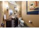 Elegant bathroom with a vessel sink, dark wood vanity, and large mirror at 5004 Se 5Th Ave, Ocala, FL 34480