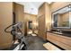 Spa-like bathroom with double vanities and a home gym at 5004 Se 5Th Ave, Ocala, FL 34480
