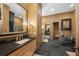 Bathroom with a large mirror, double vanity, and home gym at 5004 Se 5Th Ave, Ocala, FL 34480