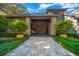 Elegant home exterior with stone pillars and a double door entry at 5004 Se 5Th Ave, Ocala, FL 34480