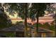 Lovely home at sunset, showcasing architectural details and mature trees at 5004 Se 5Th Ave, Ocala, FL 34480