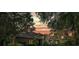 Stunning home exterior at sunset with warm lighting and beautiful landscaping at 5004 Se 5Th Ave, Ocala, FL 34480