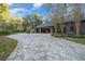 Spacious three-car garage with paved driveway at 5004 Se 5Th Ave, Ocala, FL 34480