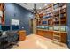 Home office features built-in bookshelves, a desk, and hardwood floors at 5004 Se 5Th Ave, Ocala, FL 34480