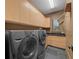 Functional laundry room with washer, dryer, and ample cabinetry at 5004 Se 5Th Ave, Ocala, FL 34480