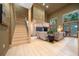 Open living room with hardwood floors, high ceilings, and a staircase at 5004 Se 5Th Ave, Ocala, FL 34480