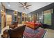 Main bedroom with a king-size bed, built-in shelving, and hardwood floors at 5004 Se 5Th Ave, Ocala, FL 34480