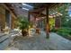 Relaxing stone patio with pergola, hot tub, and outdoor kitchen at 5004 Se 5Th Ave, Ocala, FL 34480