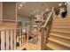 Elegant staircase with wrought iron railings and light wood steps at 5004 Se 5Th Ave, Ocala, FL 34480