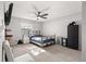 Bedroom with a queen bed, ceiling fan and window at 5091 Ne 61St Avenue Rd, Silver Springs, FL 34488