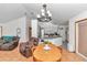 Dining room adjacent to kitchen, featuring a wooden table and chandelier at 58 Teak Loop, Ocala, FL 34472