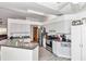 Kitchen with stainless steel appliances and gray countertops at 58 Teak Loop, Ocala, FL 34472