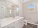 Bathroom with white vanity, quartz countertop and shower at 6194 Sw 78Th Cir, Ocala, FL 34474