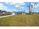 Newly built home with gray exterior, attached garage, and a grassy front yard at 6338 Nw 14Th Ave, Ocala, FL 34475