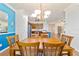 Elegant dining room with hardwood floors and a view of the kitchen at 7305 Sw 99Th Cir, Ocala, FL 34481