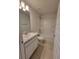 Clean bathroom with single vanity and bathtub at 7605 Sw 103Rd Loop, Ocala, FL 34476