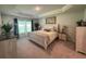 Spacious main bedroom with large windows and a dresser at 7610 Sw 102Nd Loop, Ocala, FL 34476