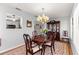 Elegant dining room with hardwood floors and a chandelier at 8357 Sw 106Th St, Ocala, FL 34481