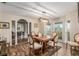 Dining room with hardwood floors, table and bay window at 8544 Nw 160Th Ave, Morriston, FL 32668