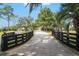 Long driveway leading to a charming house at 8544 Nw 160Th Ave, Morriston, FL 32668