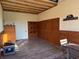 Bright tack room with wooden walls and a rustic table at 8544 Nw 160Th Ave, Morriston, FL 32668