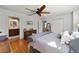 Main bedroom with hardwood floors, ceiling fan and access to bathroom and closets at 9163 Sw 186Th Ter, Dunnellon, FL 34432