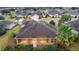 Aerial view of a house with a screened-in porch and surrounding landscaping at 9948 Sw 69Th Ln, Ocala, FL 34481