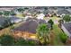 Aerial view of single-story house with screened porch and landscaped yard at 9948 Sw 69Th Ln, Ocala, FL 34481