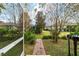 Landscaped backyard with brick pathway and lush greenery at 9948 Sw 69Th Ln, Ocala, FL 34481