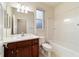 Nice bathroom with wood vanity, toilet and bathtub at 9948 Sw 69Th Ln, Ocala, FL 34481