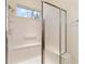 Bathroom with shower/tub combo and window for natural light at 9948 Sw 69Th Ln, Ocala, FL 34481