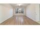 Well-lit bedroom featuring light wood-look flooring at 9948 Sw 69Th Ln, Ocala, FL 34481