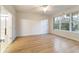 Bright bedroom with wood-look flooring and large windows at 9948 Sw 69Th Ln, Ocala, FL 34481