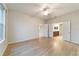 Spacious bedroom with wood-look floors and access to en-suite bathroom at 9948 Sw 69Th Ln, Ocala, FL 34481